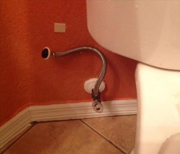 Detached supply line from toilet